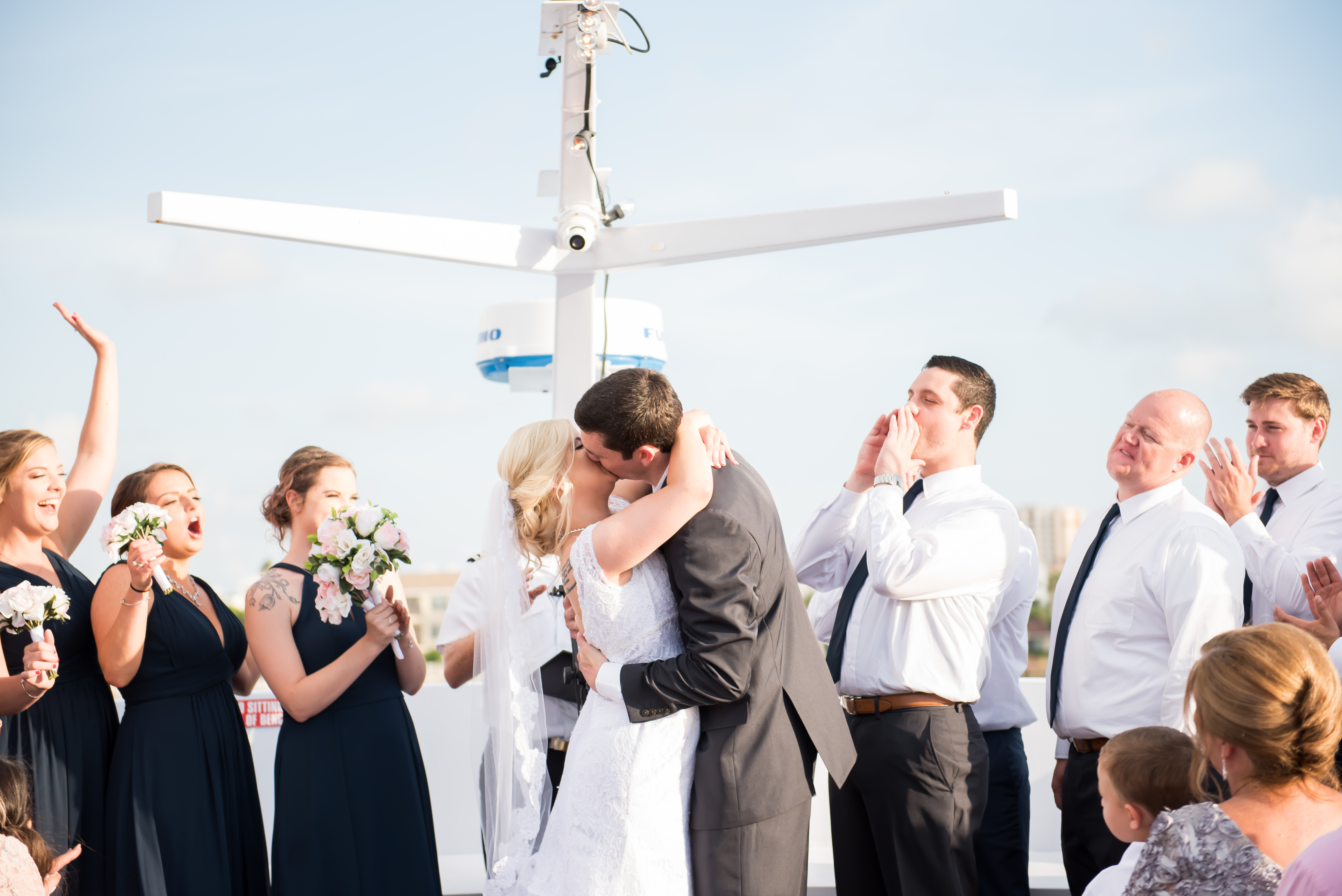 Tampa Wedding Photographer Unplugged Wedding at Yacht Starship couple kissing at ceremony nautical yacht wedding