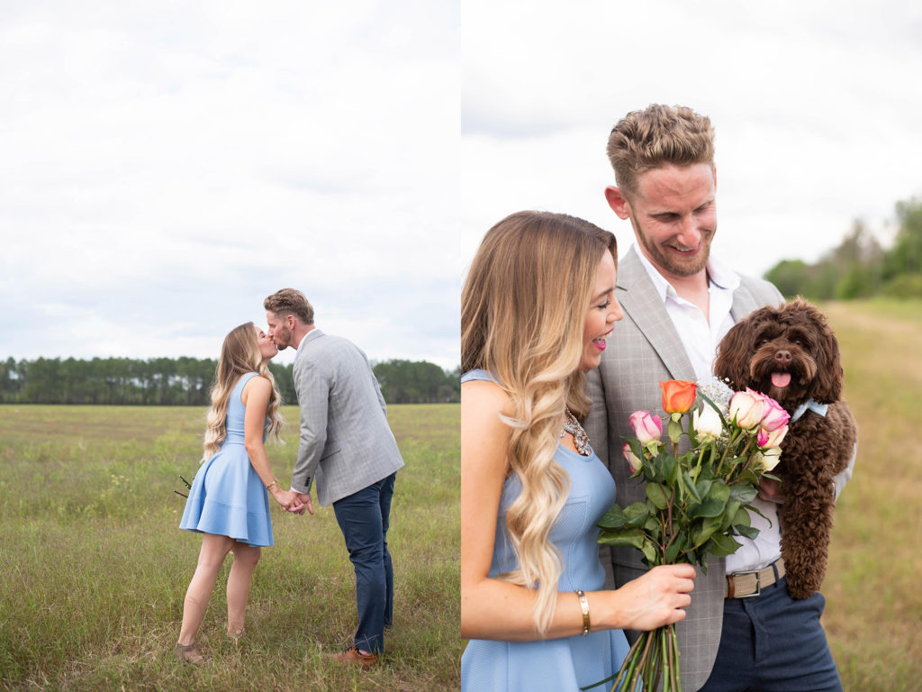 Hancock Orange Groves Engagement Session Puppy smelling flowers with couple holding him in a farm
