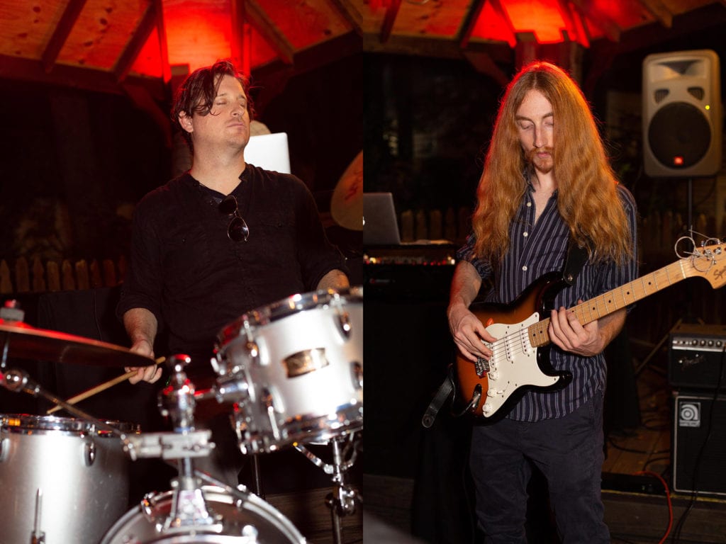 Ybor City Museum Garden Wedding Babyl Band drummer and guitarist playing at evening wedding reception