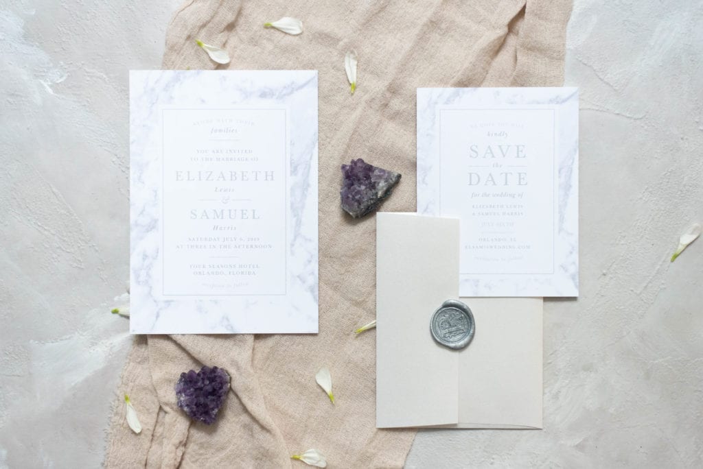 Basic Invite Marble Wedding Invitation Suite Flat Lay Photography with geode and silver wax seal