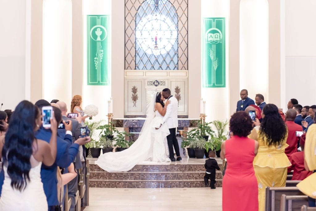St. stephen catholic church wedding bride and groom first kiss