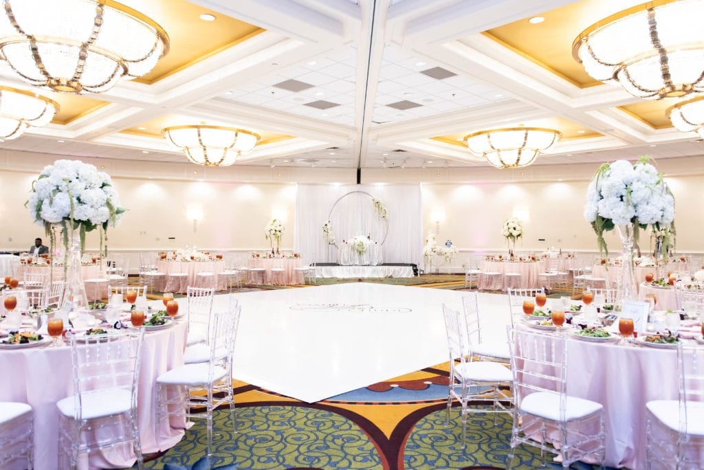 Tampa airport marriott haitian nigerian wedding in silver blush and white reception grand ballroom venue decor wide shot