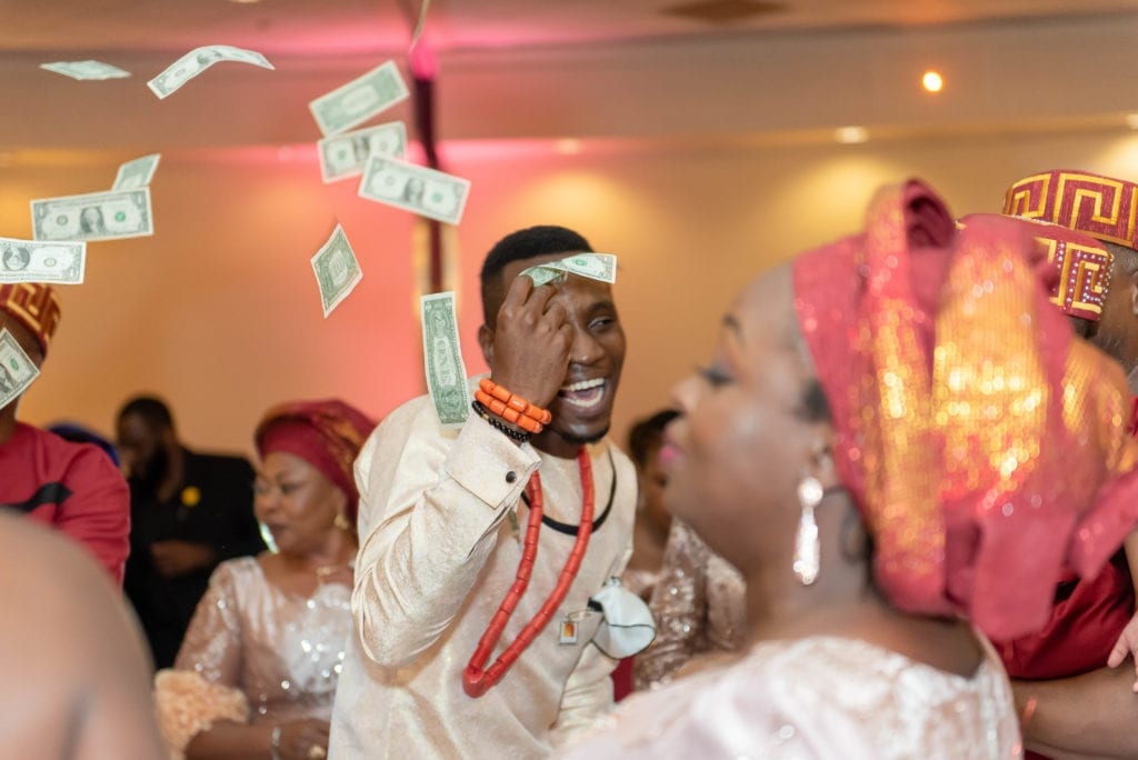 Haitian nigerian wedding reception dancing throwing dollar bills