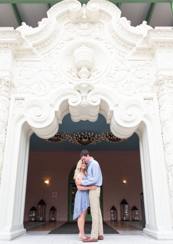 vinoy renaissance st. petersburg florida wedding anniversary photography at the grand entrance couple in light blue outfits hugging