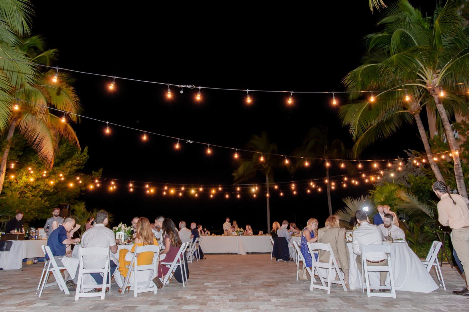 florida beach wedding reception at night with lights