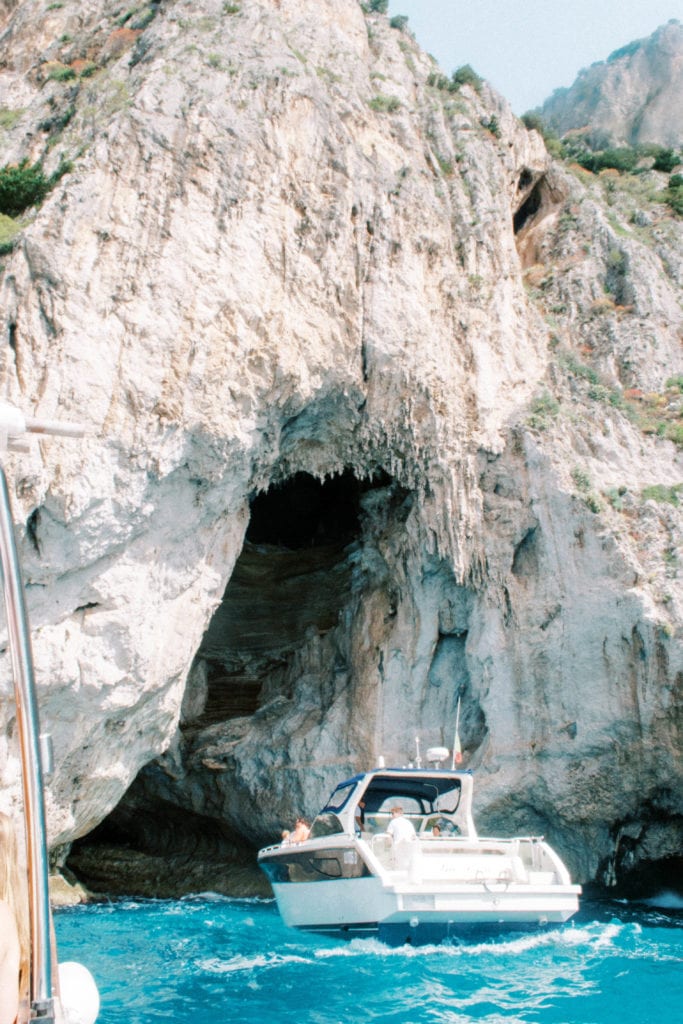 Capri Island, Italy Destination Wedding Photographer boat entering blue grotto how to plan a destination wedding