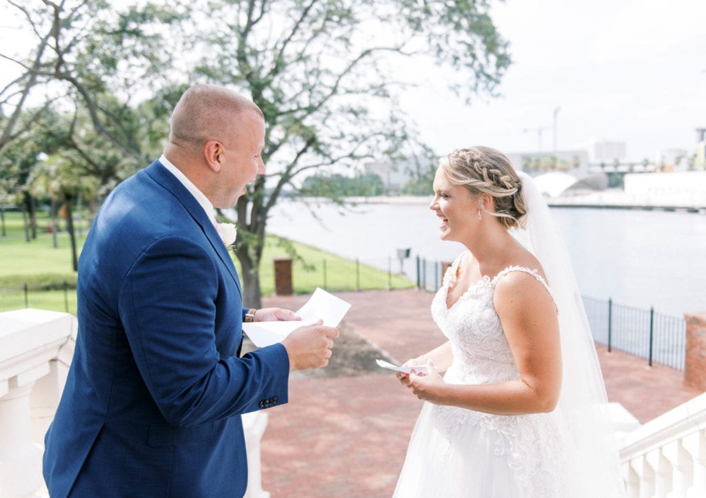 Tampa bride and groom sharing vows during first look at University of Tampa