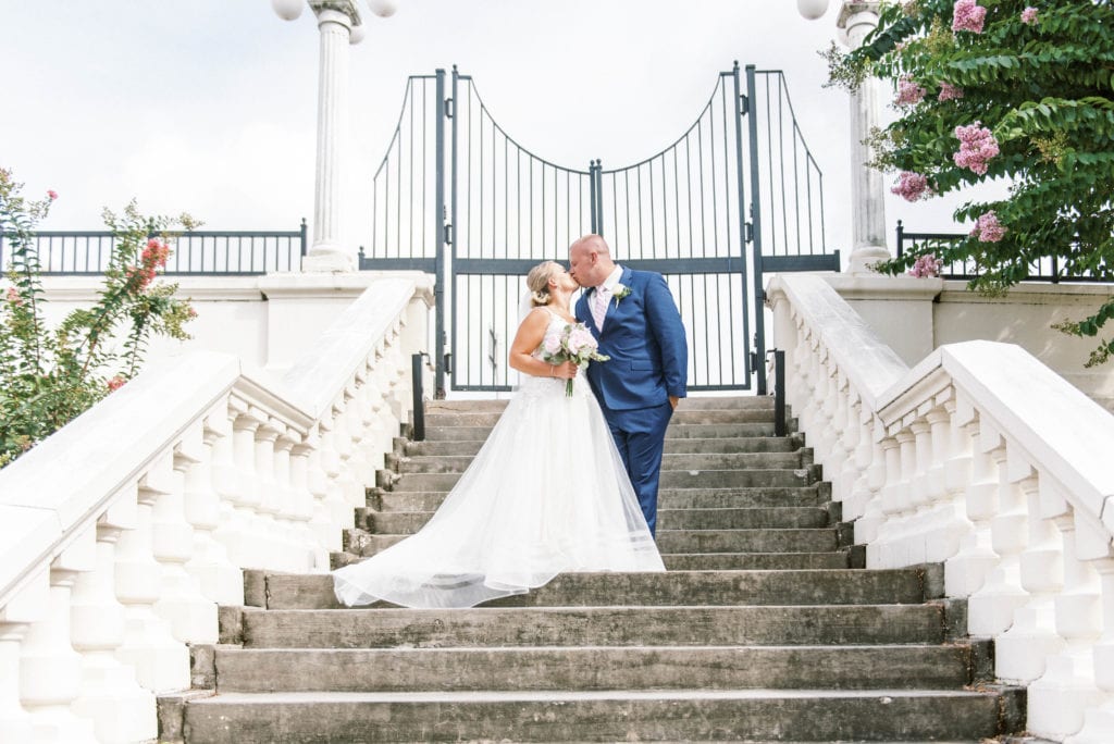 Bride and groom portraits at University of Tampa white staircase