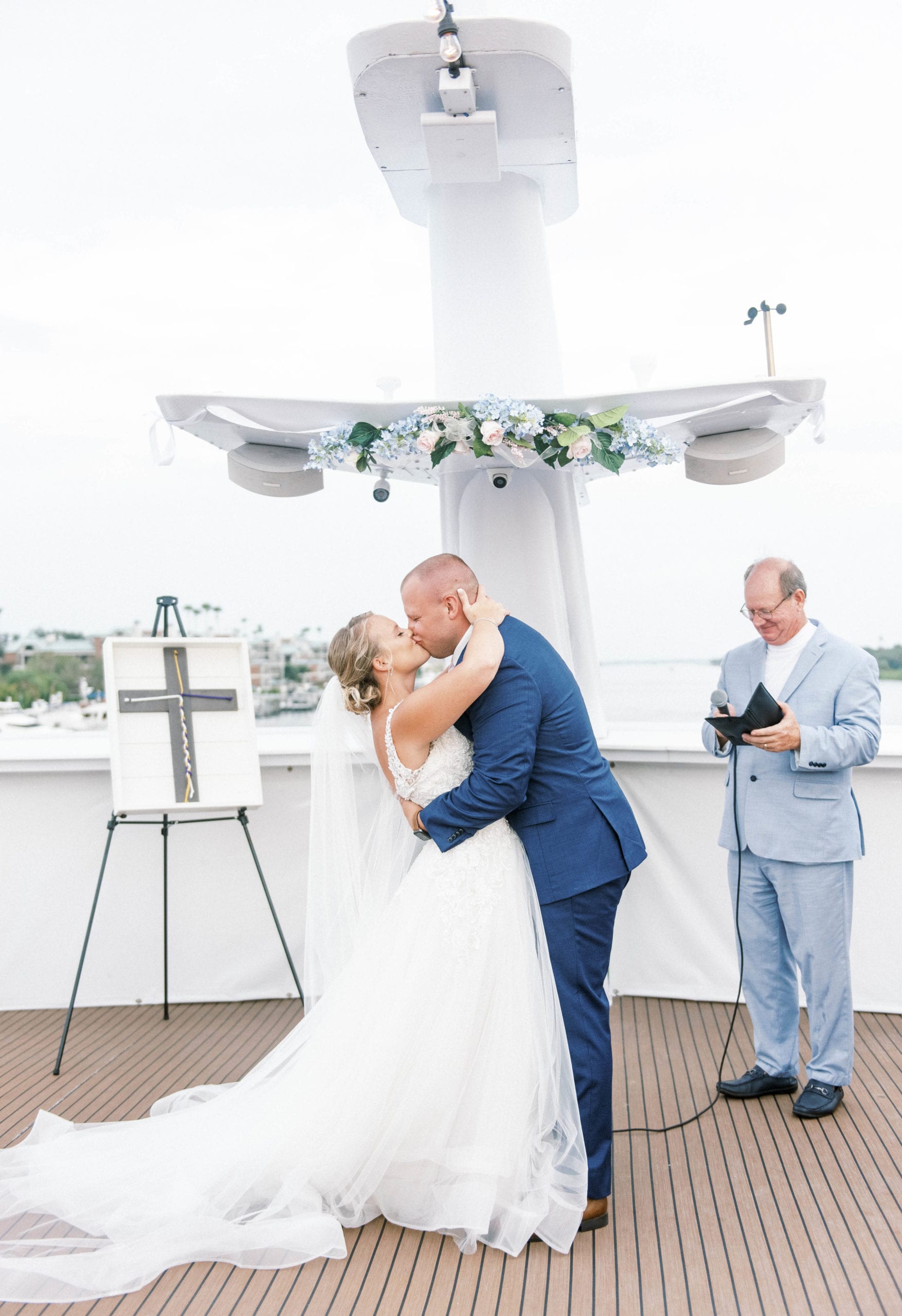 Yacht starship tampa micro wedding bride and groom kiss