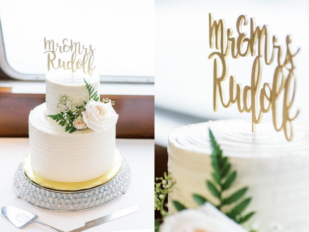 Yacht starship channelside wedding white cake with flowers and mr and mrs gold sign