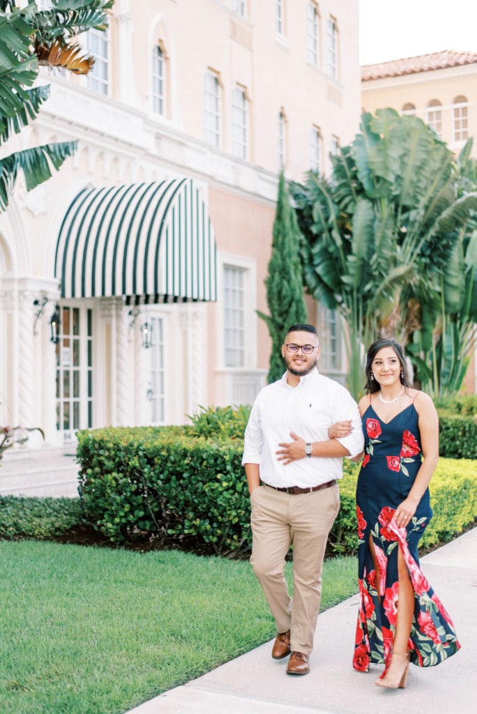 The mirasol engagement photos couple walking in front of the mirasol apartment in davis island tampa florida 