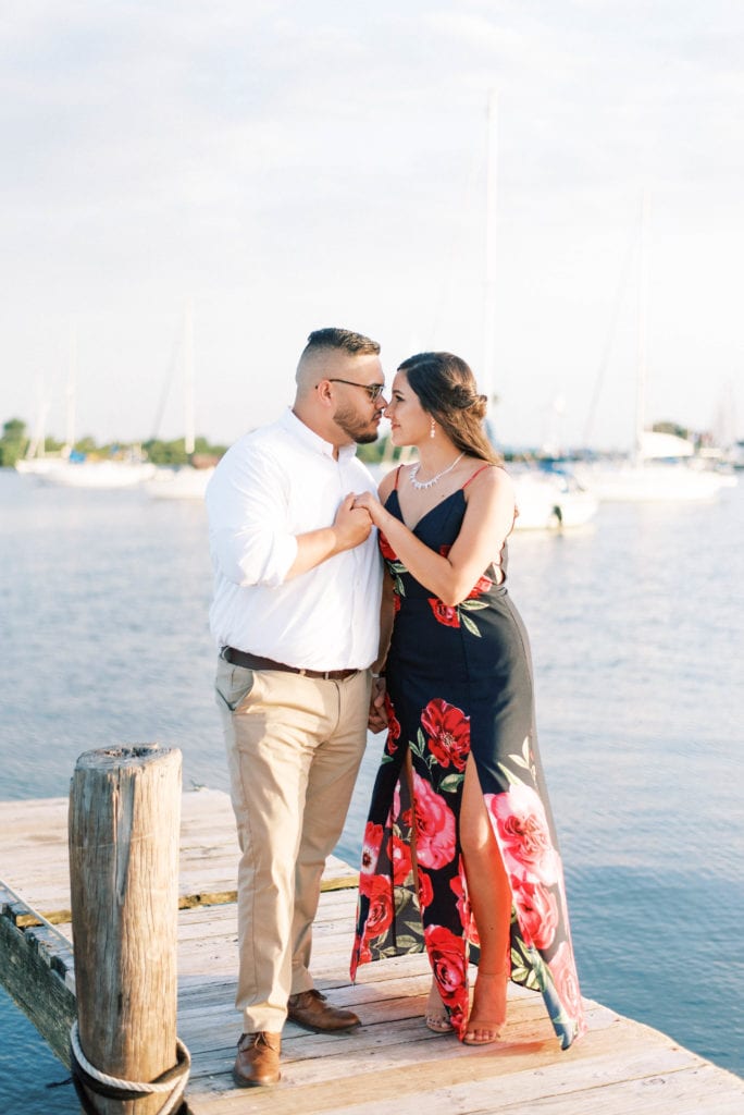 Davis Island Engagement Photos Beach photos in Tampa Florida Yacht Couple holding hands looking at each 