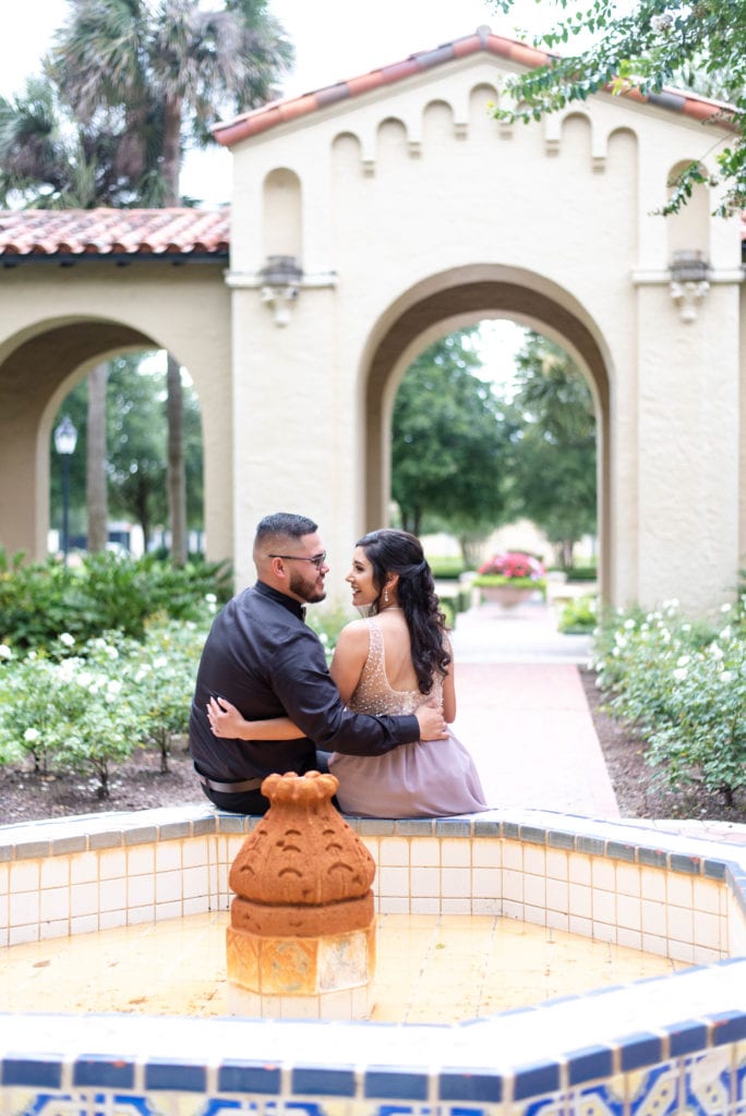 Rollins college engagement photos couple hugging looking at each other posing for the camera