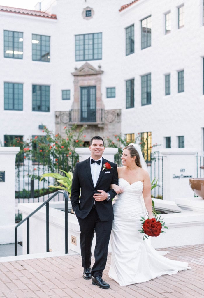 Hyatt Regency Sarasota Wedding Bride and Groom portrait in front of Spanish style building 