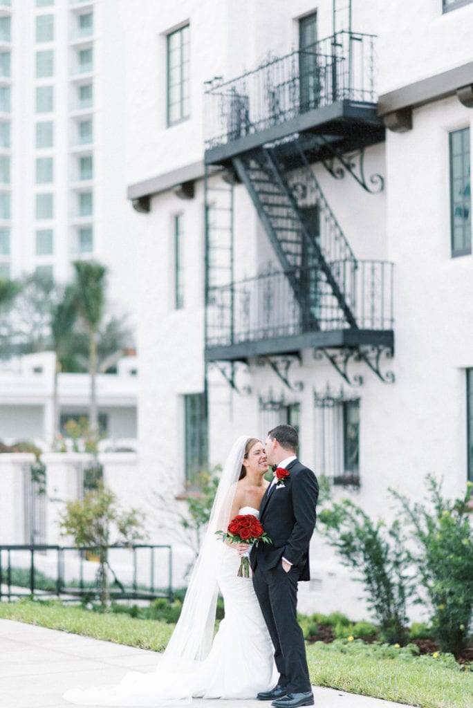 Hyatt Regency Sarasota Wedding Bride and Groom Portrait in front of Spanish architecture style building
