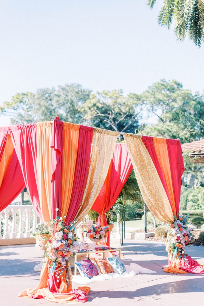 Mission Inn wedding aladdin themed wedding colorful ceremony draping for outdoors wedding