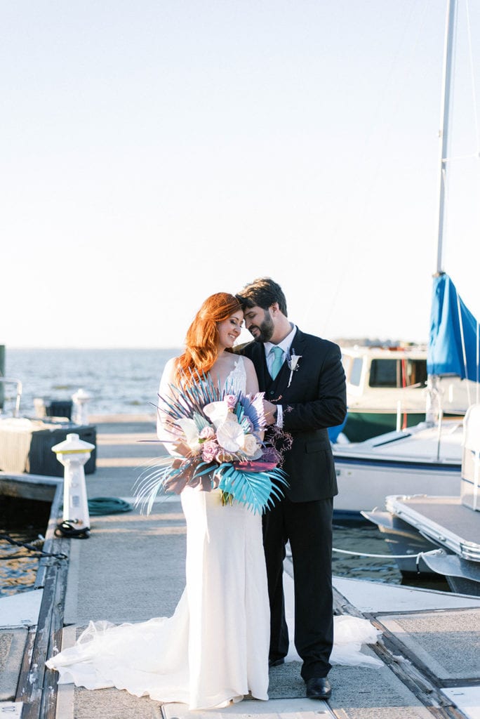 Bride and groom portait at yacht boat dock the little mermaid wedding inspiration