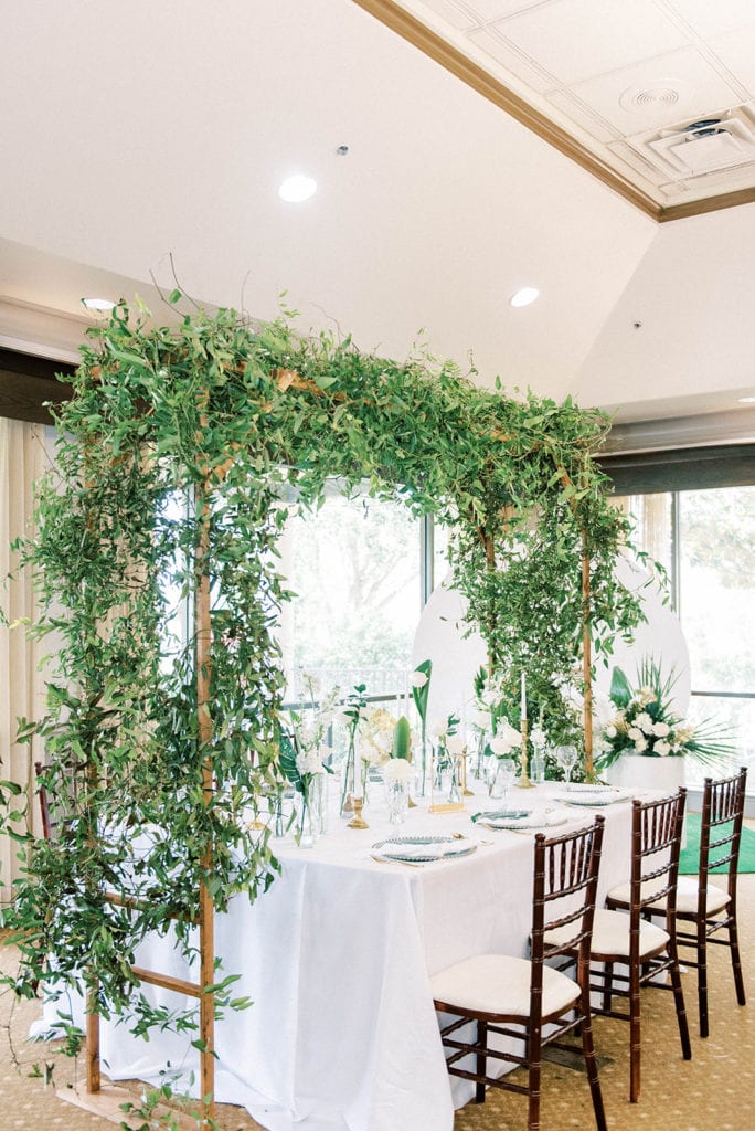 Falcons fire golf club indoors wedding white and greenery wedding decor for reception table 