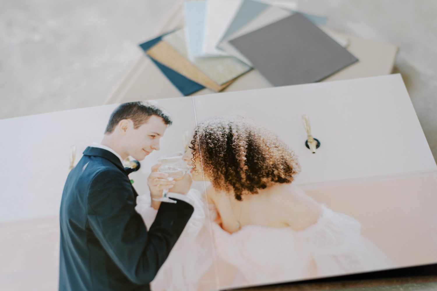 Why you need a wedding album Wedding photo book wedding family blush leather cover photo album and distressed leather brown album with colored swatches heirloom album spread open