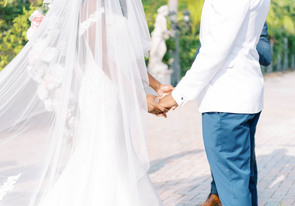 Bayanihan wedding bride and groom holding hands during wedding ceremony
