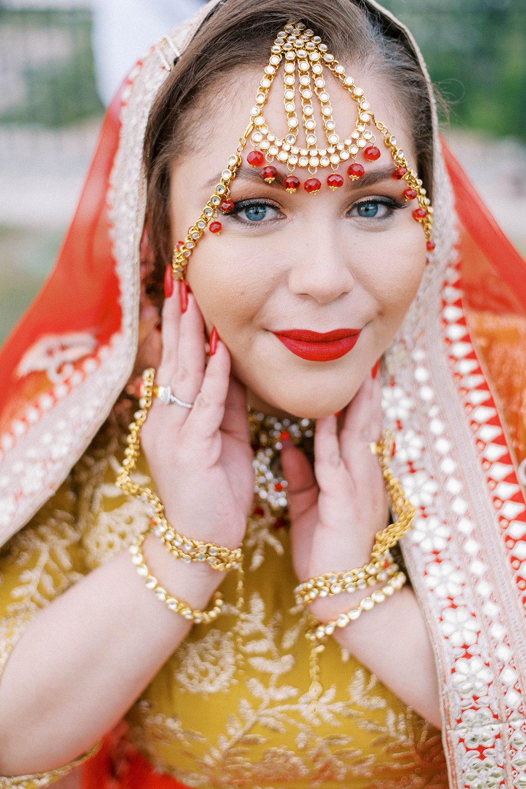 India bride posing with her saree and traditional red Indian wedding dress at her Tampa micro wedding