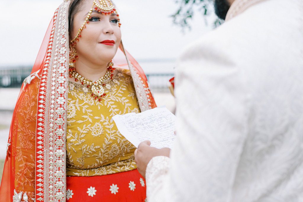 Tampa indian wedding photographer groom reading vows to Bride