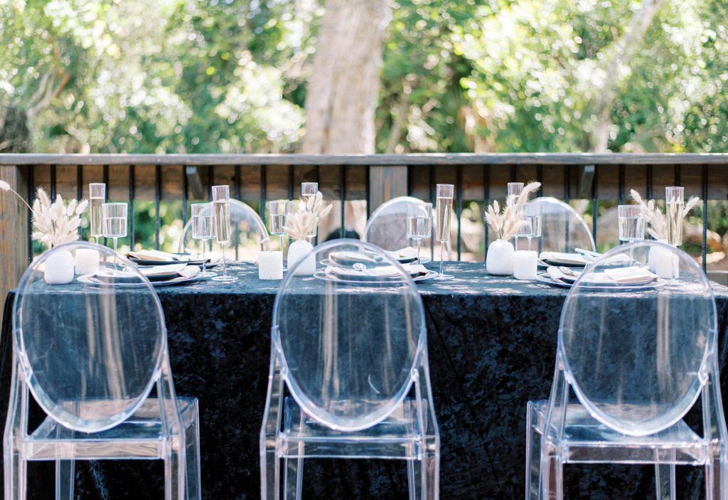 Wedding photography timeline tips for your tampa wedding photography minimalist reception table decor in black and clear chairs 