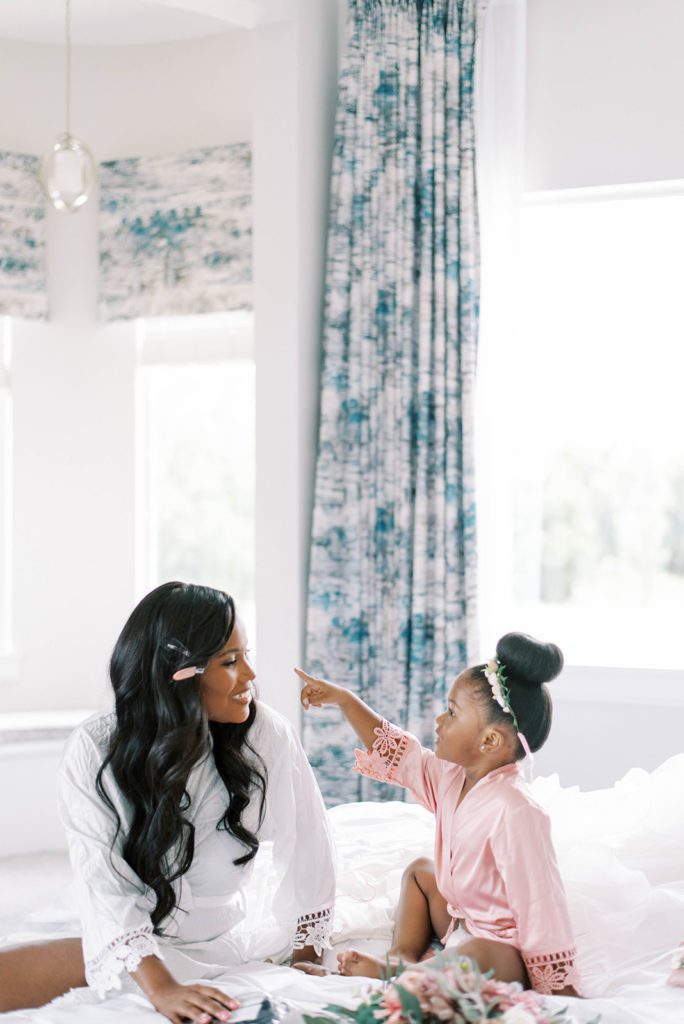 Airbnb micro wedding in tampa florida bride and daughter getting ready sharing sweet moment