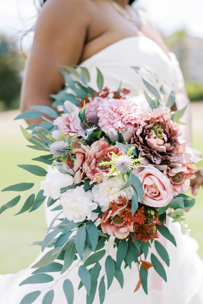 Wedding floral arrangement being hold by bride
