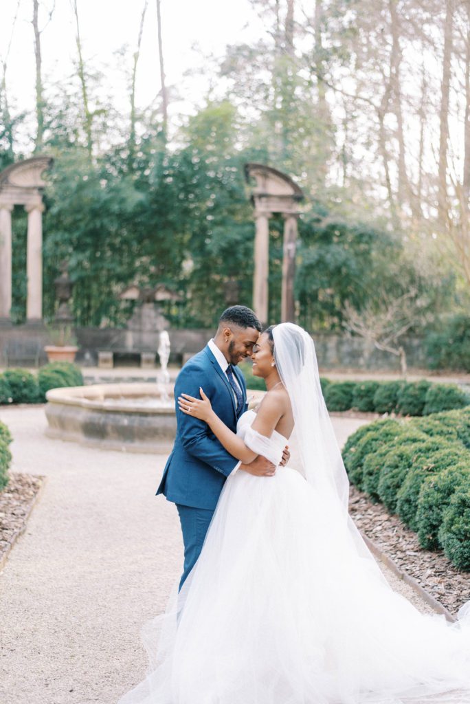 Wedding photography timeline sample and tips bride and groom embracing each other smiling at their Swan House wedding in Atlanta Georgia