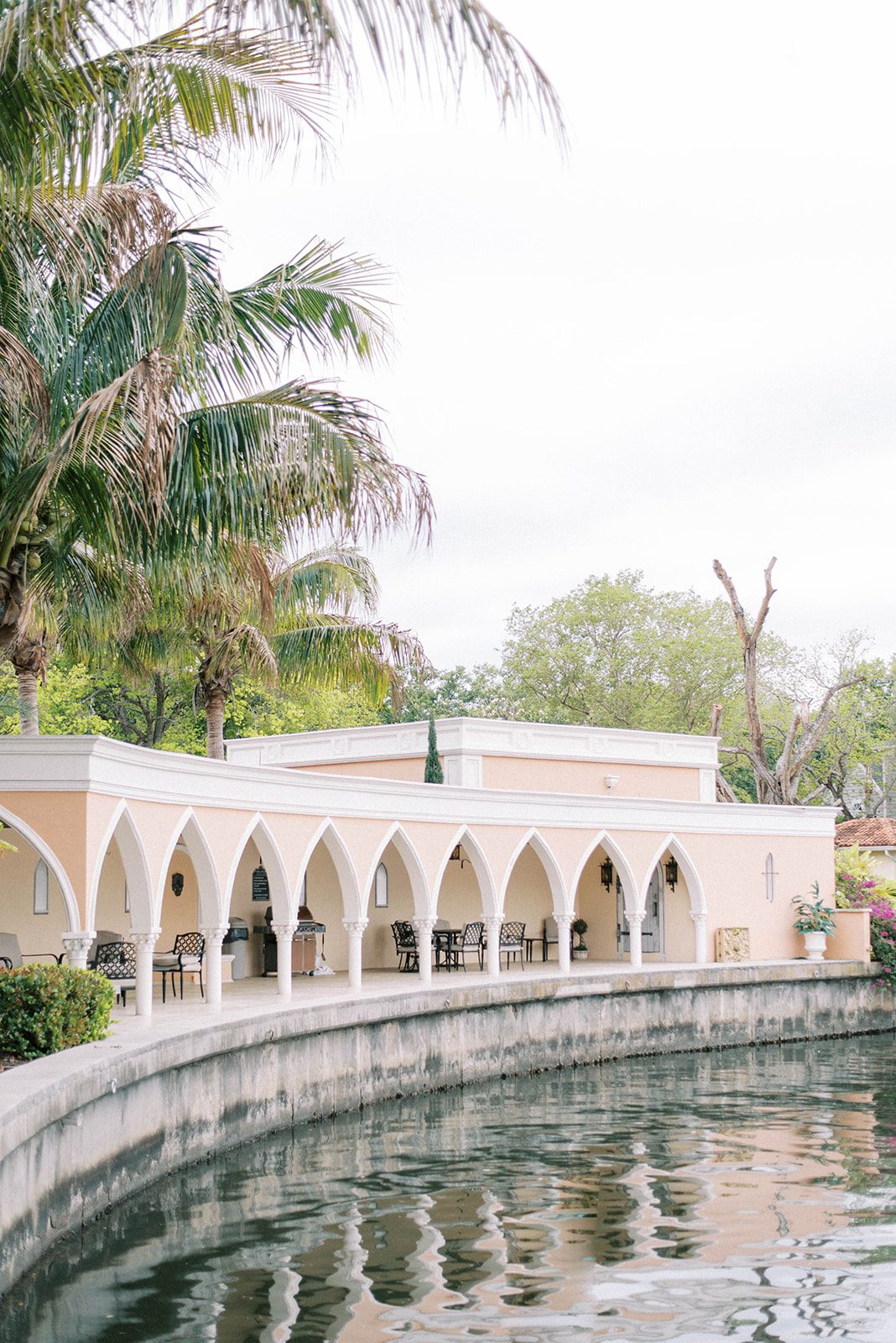 outdoor shot of the Mirasol in Florida with the arches and water feature