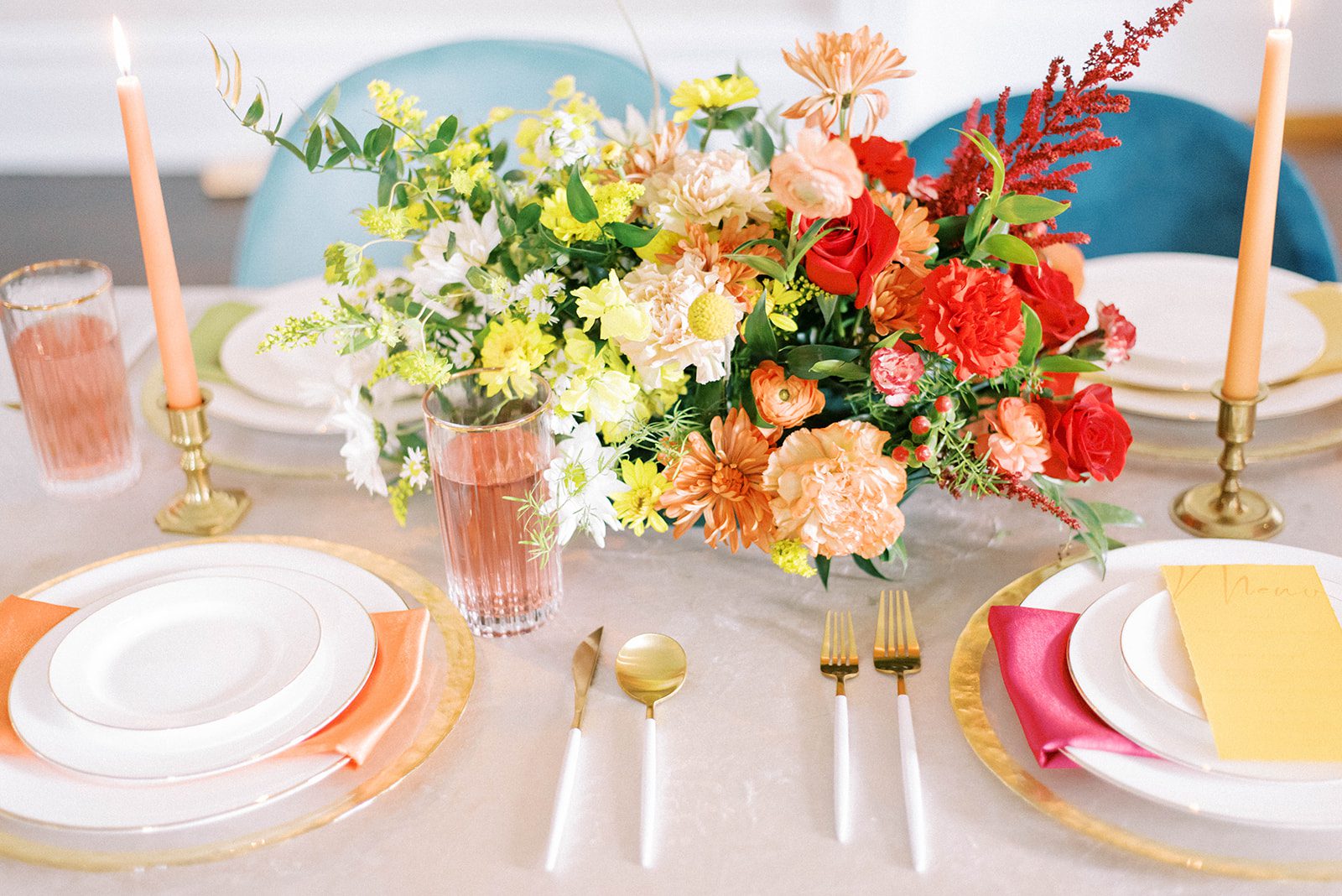 bright florals on a table setting at the Orlo