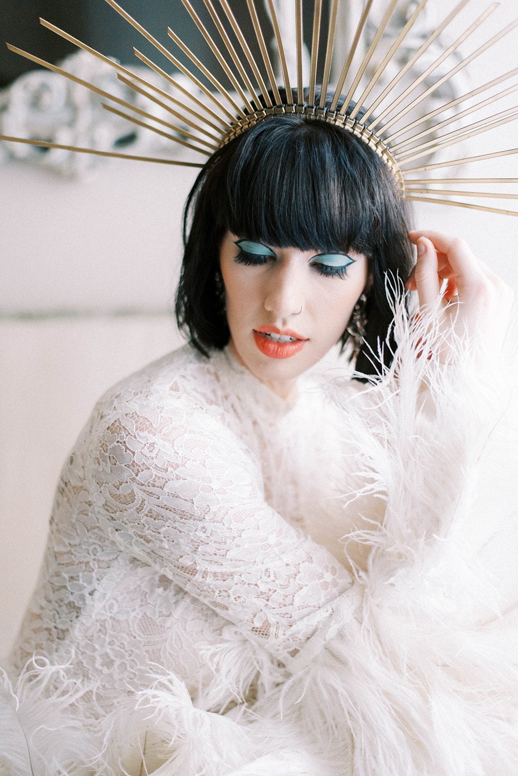 floral lace and feather retro inspired bridal look with black short haired bride in a gold diy crown