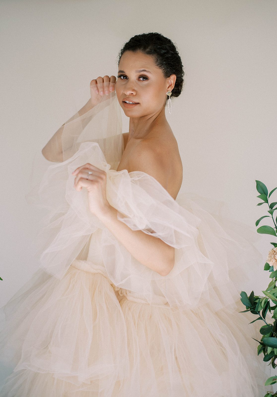 bride in a tulle ballgown poses for an editorial photo shoot for the modern bride