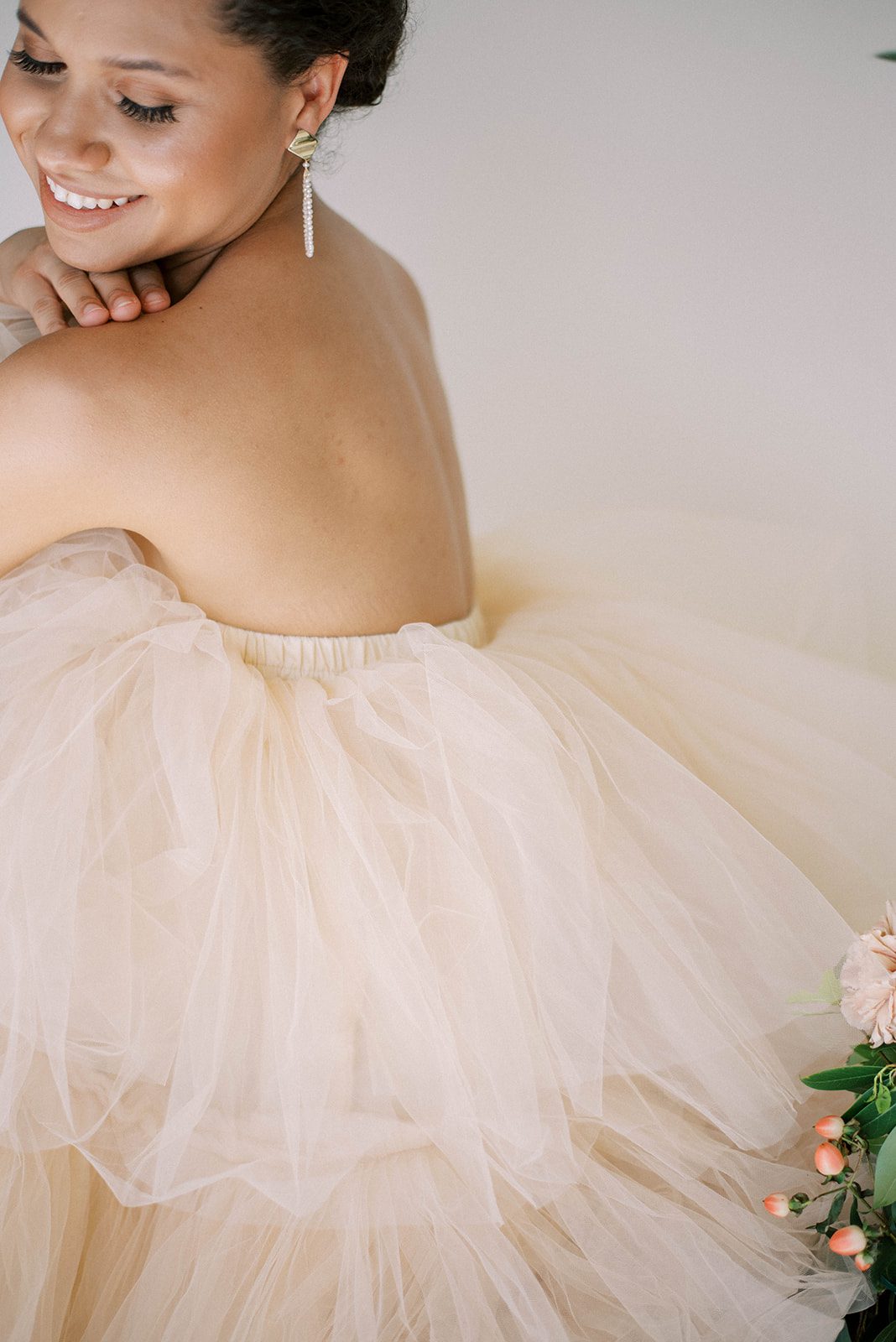 detail shot of the back of a ruffle wedding dress in the color beige in tampa Florida