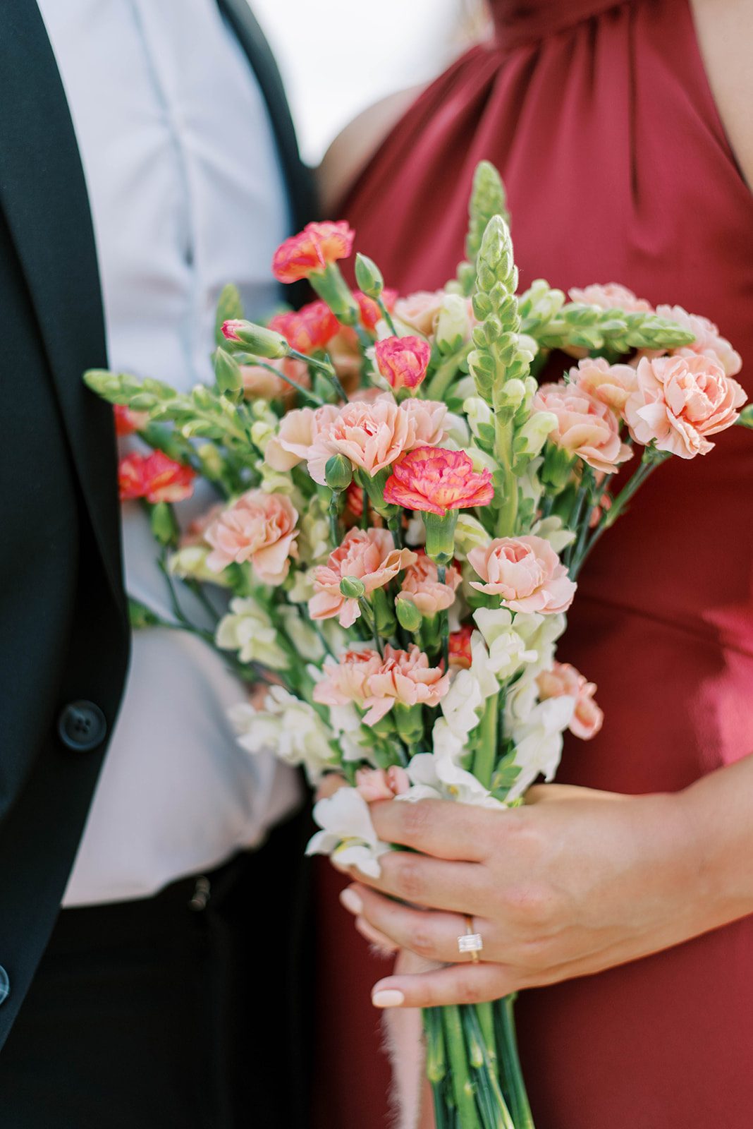 romantic engagement session in Ybor City Florida with woman holding a bouquet of flowers