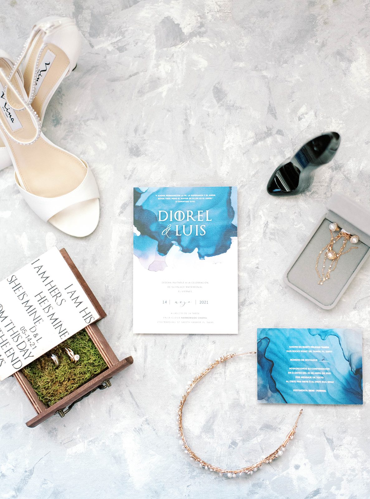 flatlay of Tampa wedding details with the wedding invitation, brides shoes and other sentiments to the day