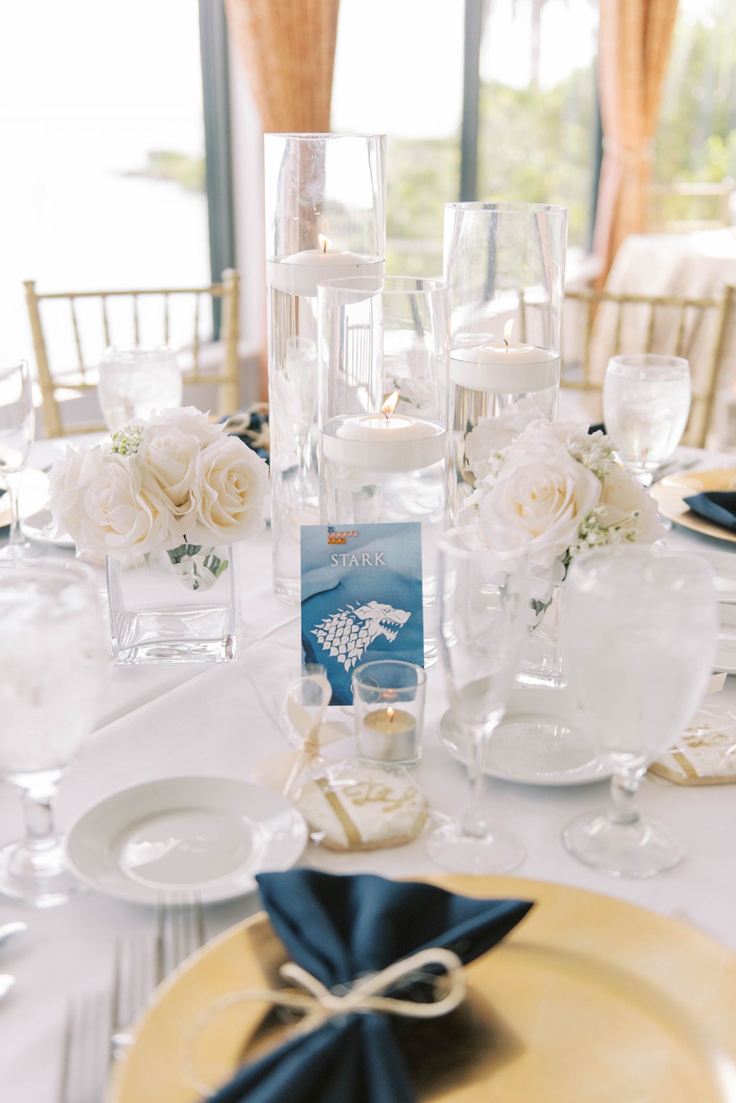 Game of Thrones themed wedding table settings with gold and blue details in Tampa Florida
