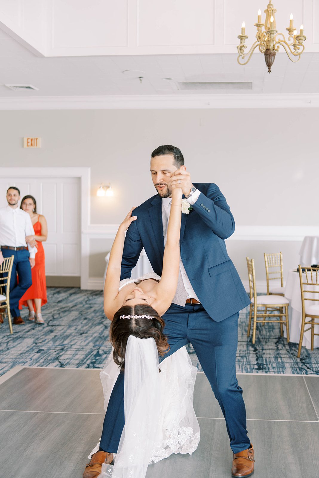 first dance with bride and groom on the dance floor at the Rusty Pelican with the groom dipping his bride