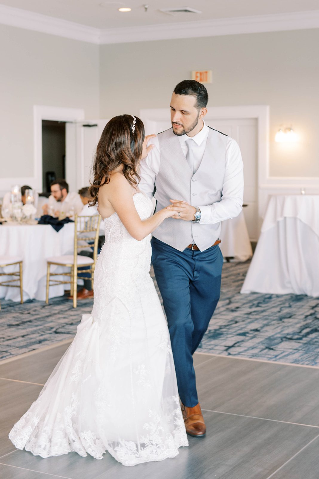 bride and groom holding hands and dancing at the Rusty Pelican Tampa Wedding Venue captured by best Tampa wedding photographers