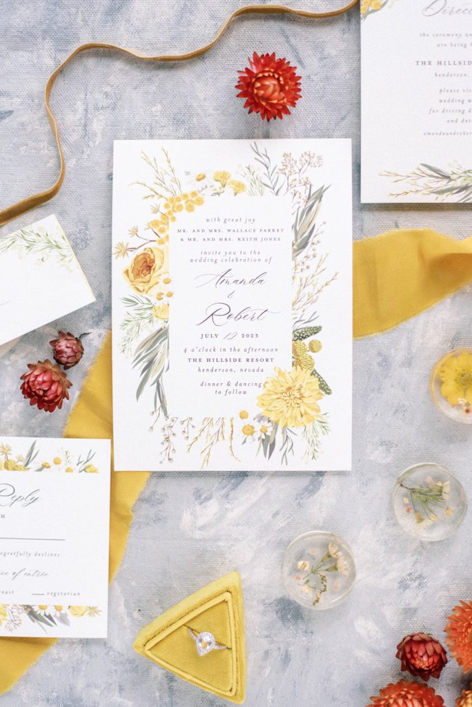 picture perfect wedding invitation with yellow and red details surroundning the invitiation for a summer wedding in Tampa Florida