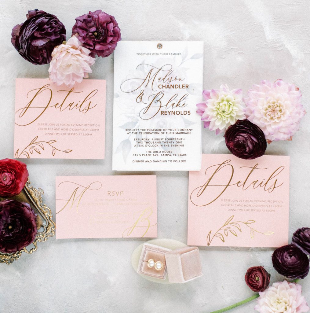 pink and pruple elegant picture perfect wedding invitations arranged in a flatlay in Tampa Florida wedding
