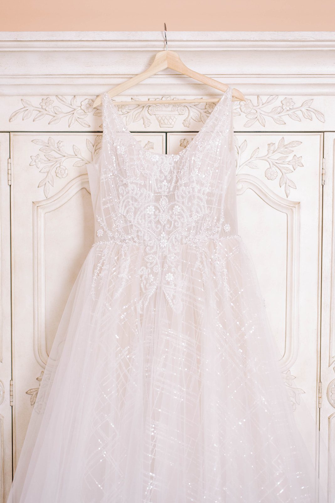 bridal wedding dress hanging on beautiful door in a bridal suite for a St. Petersburg wedding