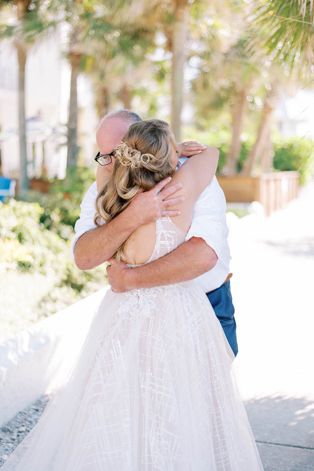 Tampa bride hugs her groom during their first look together during their boho wedding in Tampa Florida