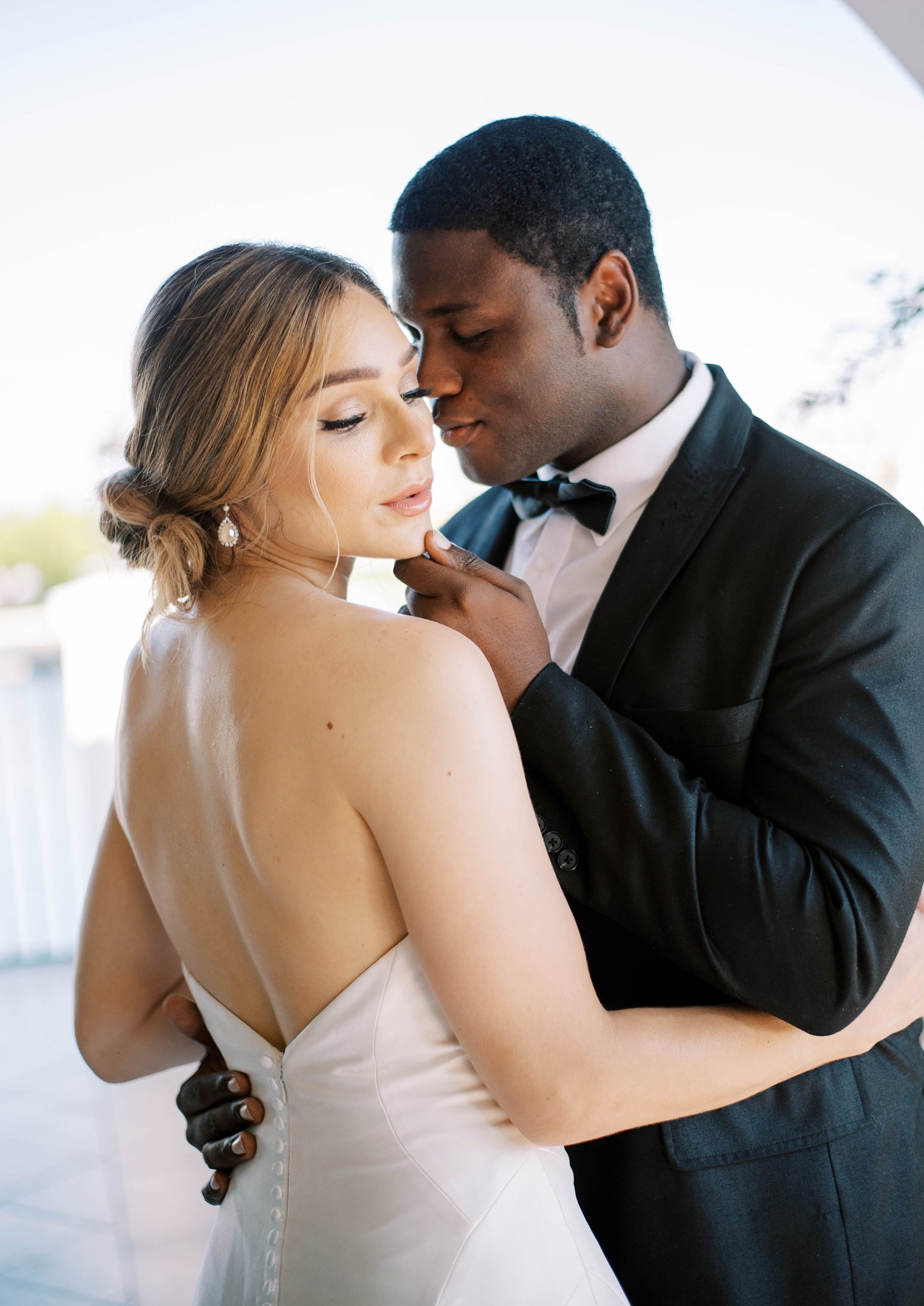 bride and groom hug together touching noses in St. Pete FL