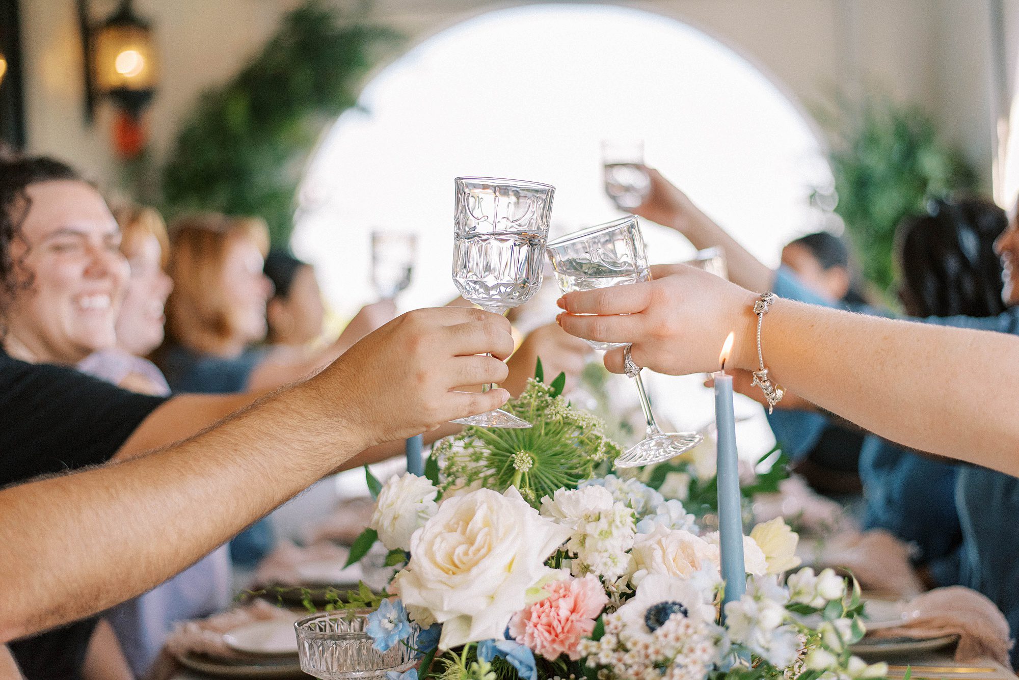 guests toast champagne over table at Hotel Zamora wedding