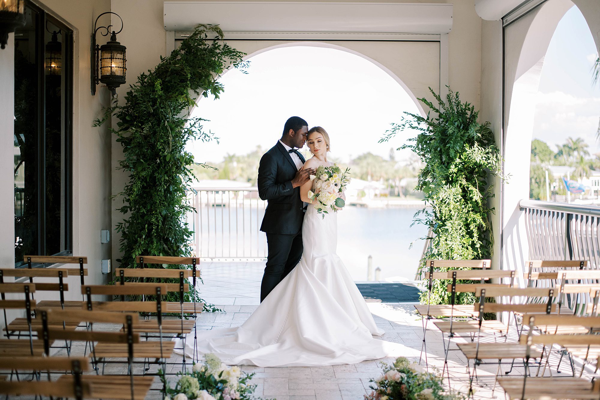 couple poses at ceremony site at the Hotel Zamora