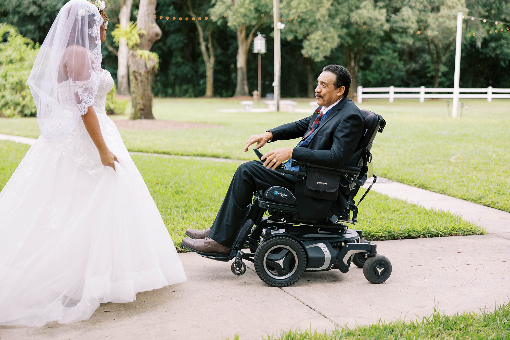 bride has first look with dad in wheelchair at Casa Lantana