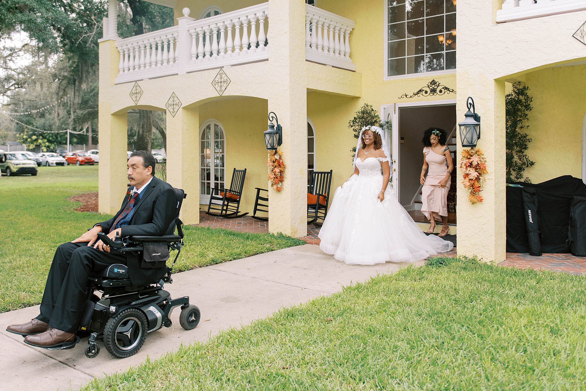 bride approaches dad in wheelchair for first look