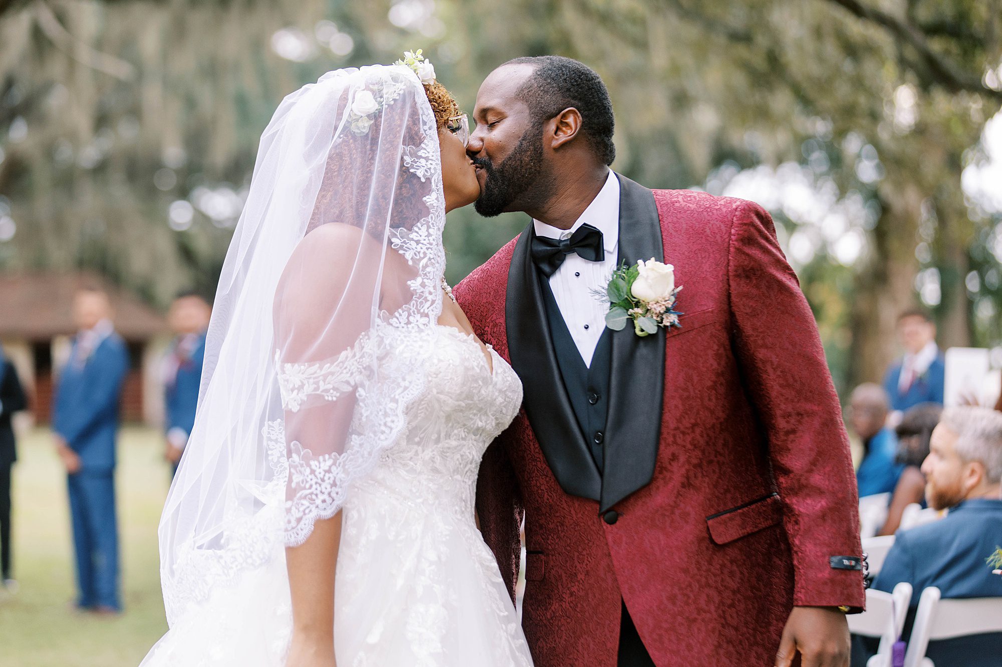 bride and groom kiss up aisle after ceremony in Florida